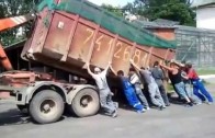 Hook Lift Truck loading up a container